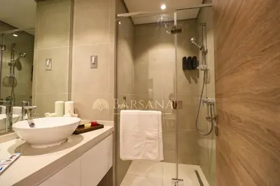 a bathroom with a sink and a shower at Barsana - Azure Marina Apartment - 3Bed - Full Marina View in Dubai
