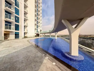 a view of a building with a swimming pool at GuestReady - Studio Suite l Community Jacuzzi in Dubai