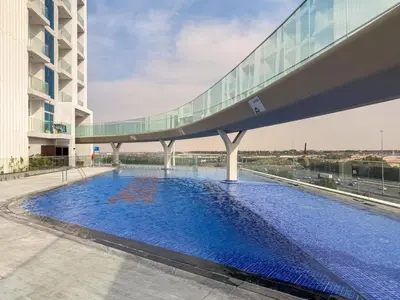 a swimming pool on the roof of a building at GuestReady - Studio Suite l Community Jacuzzi in Dubai