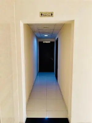 a hallway in a building with a sign on the ceiling at Modern Studio With Scenic Views in Dubai
