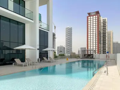 a large swimming pool on top of a building at LAREDA BY VIBY Vacation Homes Rental in Dubai