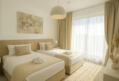a hotel room with two beds and a window at Luxurious Apartment with Burj Khalifa View in Downtown in Dubai