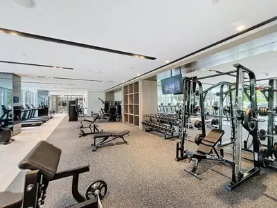 a gym with several treadmills and machines in a building at Luxurious Apartment with Burj Khalifa View in Downtown in Dubai