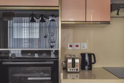 a kitchen with a microwave and a coffee maker at Luxe 2 Bedroom Apartment in Dubai Marina in Dubai