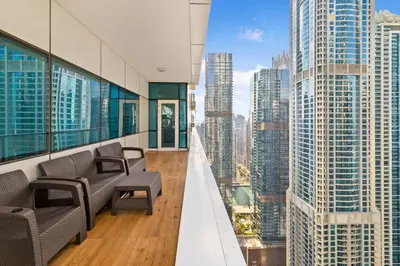 an office with chairs and a view of a city at Luxe 2 Bedroom Apartment in Dubai Marina in Dubai