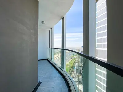 an elevator in a building with a view of a city at Elegant 1BDR Sleeps 4 in Bayz-22 in Dubai