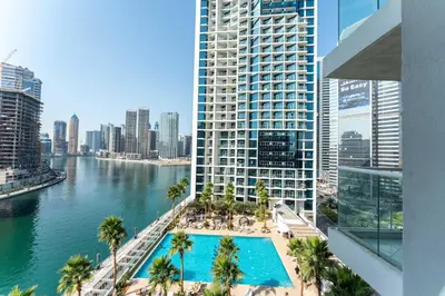 an aerial view of a building with a swimming pool at PVH - Damac Maison Prive - Studio with Canal and Pool View in Dubai