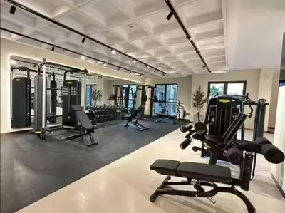 a gym with several treadmills and machines in it at Vogue Madinat Jumeirah Living Jadeel near Burj AlArab, One-Bedroom Apartment with Large Balcony and Pool View, Access to All Amenities in Dubai