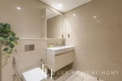 a bathroom with a sink and a mirror at LUX 2BR High Floor - Near Dubai Mall in Dubai