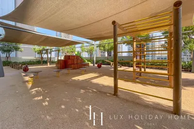 a pavilion with a bench under a canopy at LUX 2BR High Floor - Near Dubai Mall in Dubai