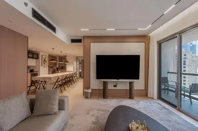 a living room with a flat screen tv and a couch at Murjan 2702 in Dubai