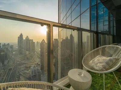 a balcony with a view of a city at Luxury 1BR High floor Paramount Midtown in Dubai