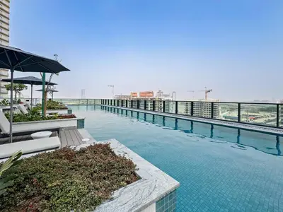 a swimming pool on the top of a building at Premium 3BR Study in Sobha Hartland in Dubai
