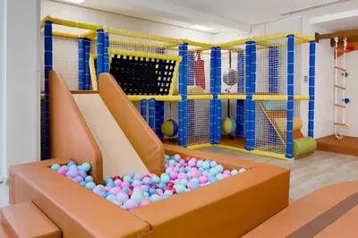 a room with a bunch of balls in a gym at Chic Studio in Me Do Re JLT YOLO in Dubai