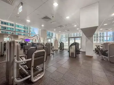 a gym with rows of chairs in a building at Downtown Three Beds near to Burj Khalifa and Dubai Mall in Dubai