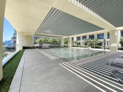 a swimming pool in the middle of a building at Silkhaus Prime 1BDR in Burj Royale in Dubai