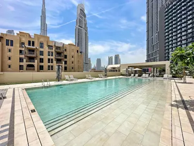 a large swimming pool on top of a building at Silkhaus Prime 1BDR in Burj Royale in Dubai