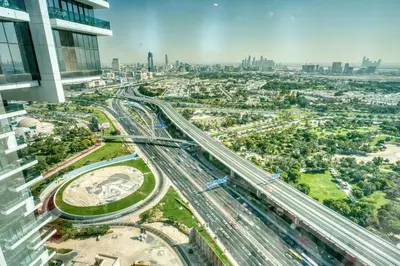 an aerial view of a city with traffic at Upscale Modern 2-Bedroom with Elegant Interiors in Dubai