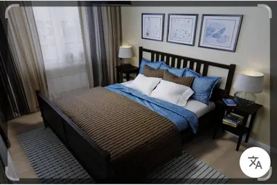a bedroom with a large bed with blue and white pillows at شقة غرفة وصالة Apartment one bad room in Dubai