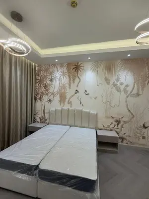 a bedroom with a large bed and a wall with wallpaper at 403,1 BHK lake View, V3 tower, JLT Royal Montania in Dubai