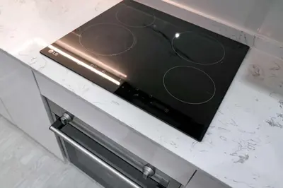 a stove top oven sitting on top of a counter at StayShort - Stlylish 2 Bedroom in Dubai Marina that Sleeps 4 Near Metro in Dubai