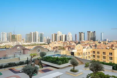 a view of a city with tall buildings at FIRST CLASS 1BR Pearl House Elegance in Dubai