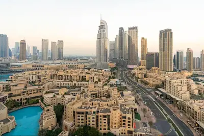an aerial view of a city with tall buildings at Vogue Downtown Burj Residence Near Dubai Mall and Burj Khalifa, Three Bedroom Plus Maid's room Apartment with Balcony and City View, Access to all Amenities in Dubai