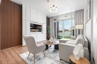 a living room with a couch and a table at Palm Jumeirah Luxury Direct Beach Access and Views in Dubai