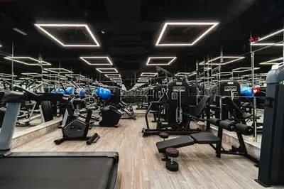 a gym with lots of exercise equipment in it at Vogue JVC Al Serh Residences Near Circle Mall, One Bedroom Plus Maid's room Apartment with Balcony and City View, Access to all Amenities in Dubai