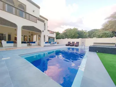 a swimming pool in the backyard of a house at Royal Palazzo with private Pool and BBQ on Marina, huge 7Bedroom Villa in Dubai
