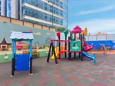 a childrens playground with a colorful playground at Sunny Studio with Pool, Gym & Sauna in Dubai Escape in Dubai
