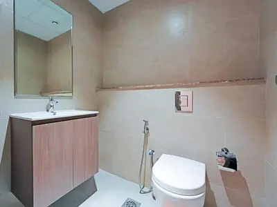 a bathroom with a toilet and a sink at Comfortable 2-Bedroom Home in Al Furjan-607 in Dubai