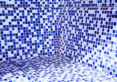 a bathroom with blue and white tiles on the wall at Luxury Apt Canal View - 5min Burj & Dubai Mall in Dubai