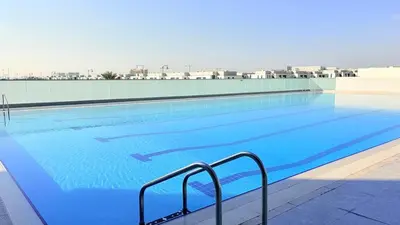 a large swimming pool on top of a building at Ready-to-Move 1-Bedroom in Al Furjan-103 in Dubai