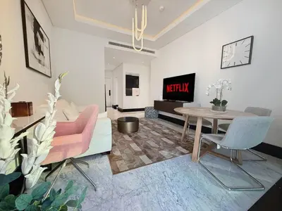 a living room with a couch and a table at Premium Luxury 2BR Business Bay - Valet parking, Pool, Gym, SPA and Ice room in Dubai