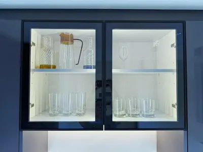 two glass doors of a cabinet filled with glasses at Premium Luxury 2BR Business Bay - Valet parking, Pool, Gym, SPA and Ice room in Dubai
