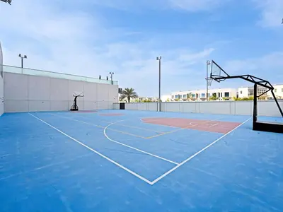 an empty basketball court with a basketball hoop at Well-Maintained 2-Bedroom Apartment Al Furjan-207 in Dubai