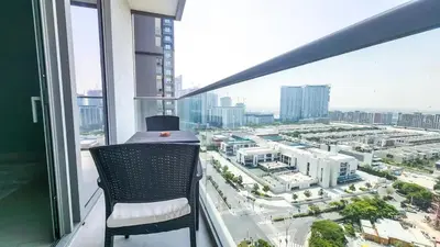 a balcony with a chair and a view of a city at STAY BY LATINEM Luxury 1BR Holiday Home CVR A 1410 near Downtown in Dubai