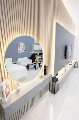 a living room with a white couch and a mirror at Extra-Large Studio l AG Tower l Business Bay in Dubai