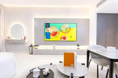 a living room with a large painting on the wall at Extra-Large Studio l AG Tower l Business Bay in Dubai