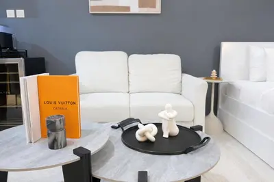 a living room with a white couch and a coffee table at Extra-Large Studio l AG Tower l Business Bay in Dubai