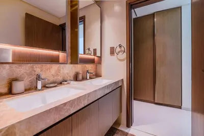 a bathroom with two sinks and a shower at TRPS - Grand Bleu Tower 2, EMAAR Beachfront - Atlantis & Marina View, Private Beach, Furnished in Dubai