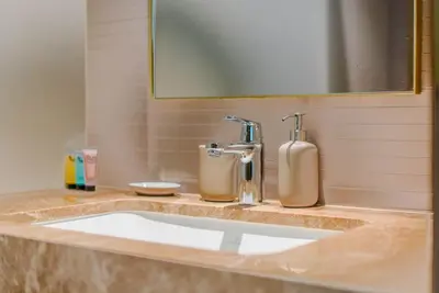a bathroom counter with a sink and a mirror at TRPS - Grand Bleu Tower 2, EMAAR Beachfront - Atlantis & Marina View, Private Beach, Furnished in Dubai