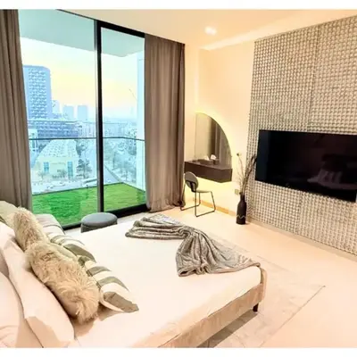 Chic Modern Studio Unit in JVC with 65 inch TV