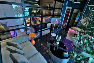 a living room with a couch and a table at The Eden Suite Modern Luxury Meets Cozy Comfort in Dubai