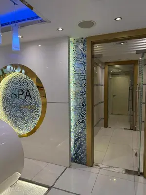 a lobby of a building with a tile wall at Fully Luxury Studio Total Privacy Pool & Sauna in Dubai