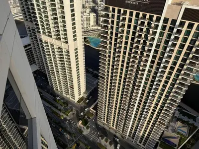 an aerial view of two tall buildings in a city at 17 Icon Bay Creek Harbour in Dubai