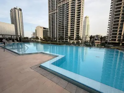a large swimming pool in a city with tall buildings at 17 Icon Bay Creek Harbour in Dubai