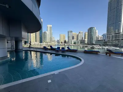 a swimming pool on a building with a view of a city at The Point Tower Dubai Marina in Dubai
