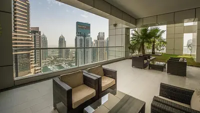 a balcony with chairs and a view of a city at Penthouse with panoramic water-view Ultra-luxury in Dubai